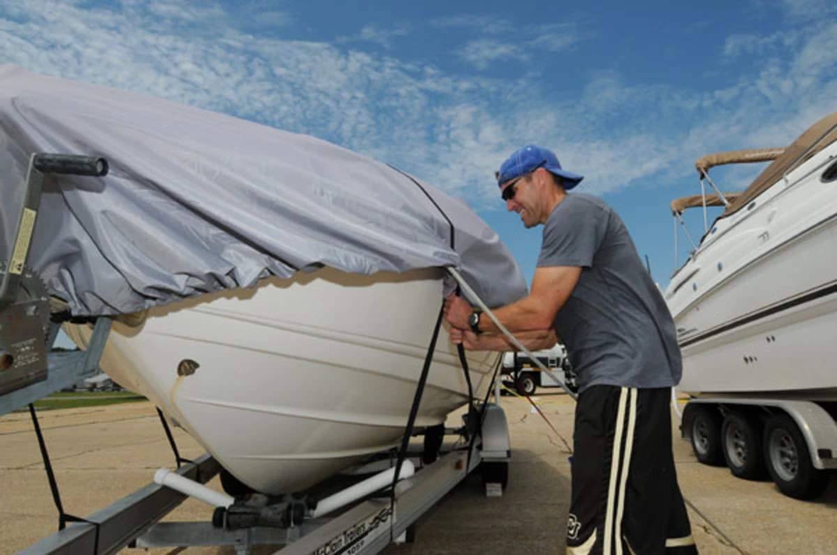 Tying your boat to its trailer helps prevent it from floating away in the flood waters a hurricane can bring